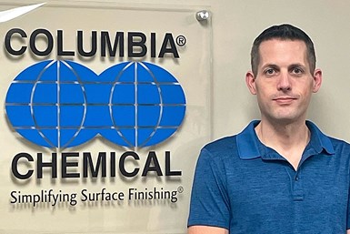 Products Finishing 40-Under-40 nominee, standing in front of a Columbia Chemical logo